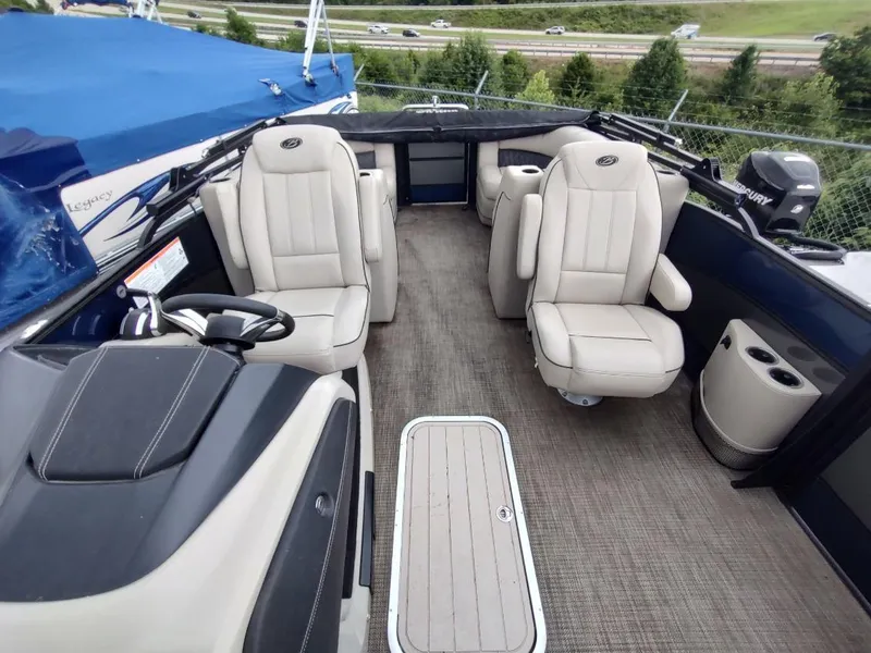 Slide: The Image of 2020 Barletta L23QC pontoon boat interior with plush seating and modern design. - 3