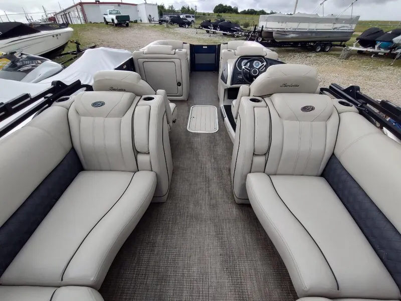 Slide: The Image of 2020 Barletta L23QC pontoon boat interior with luxurious seating and modern dashboard. - 5