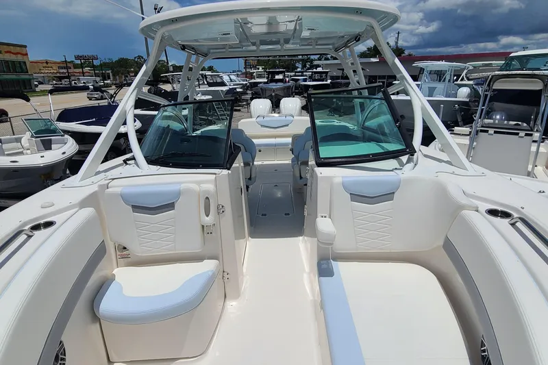 Slide: The Image of 2024 Robalo R317 Dual Console boat with spacious seating and modern design. - 6