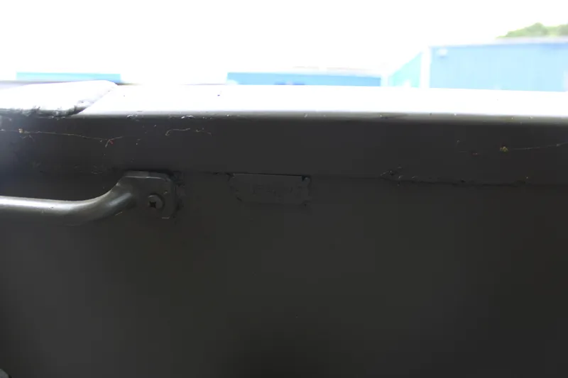 Slide: The Image of Close-up of a 2025 WeldBilt 1548V boat's metal surface and handle. - 4