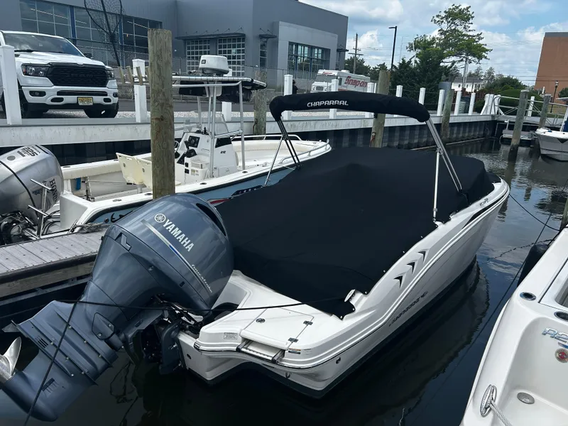 Slide: The Image of 2018 Chaparral 21 H2O Sport OB boat docked with Yamaha outboard engine. - 10