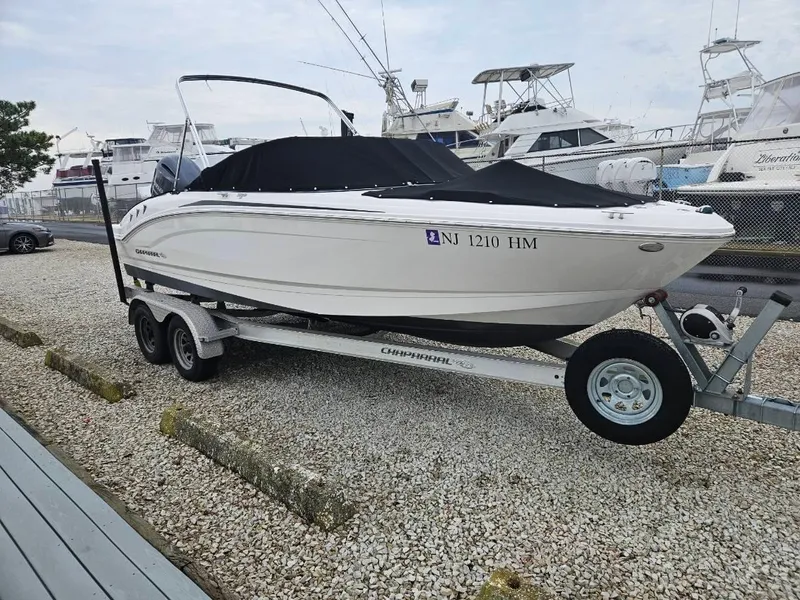 Slide: The Image of 2018 Chaparral 21 H2O Sport OB boat on trailer, parked in marina. - 12