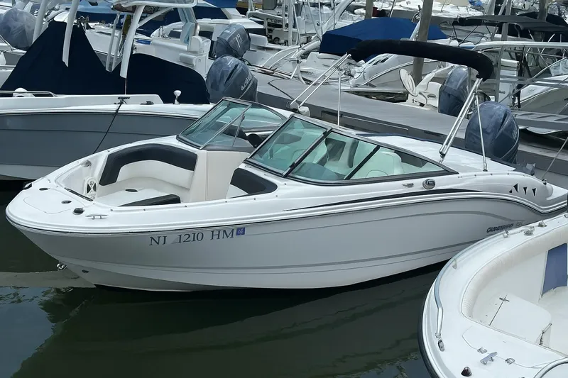 Slide: The Image of 2018 Chaparral 21 H2O Sport OB boat docked in marina. - 2