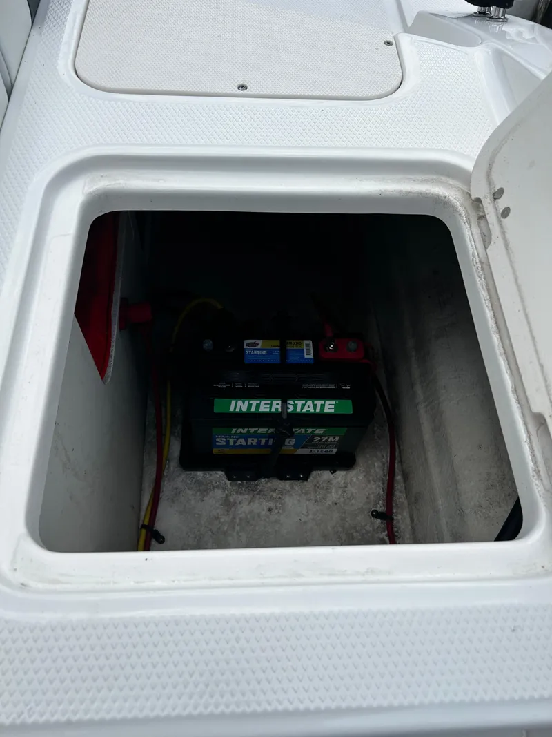 Slide: The Image of Battery compartment of 2018 Chaparral 21 H2O Sport OB with Interstate battery. - 31