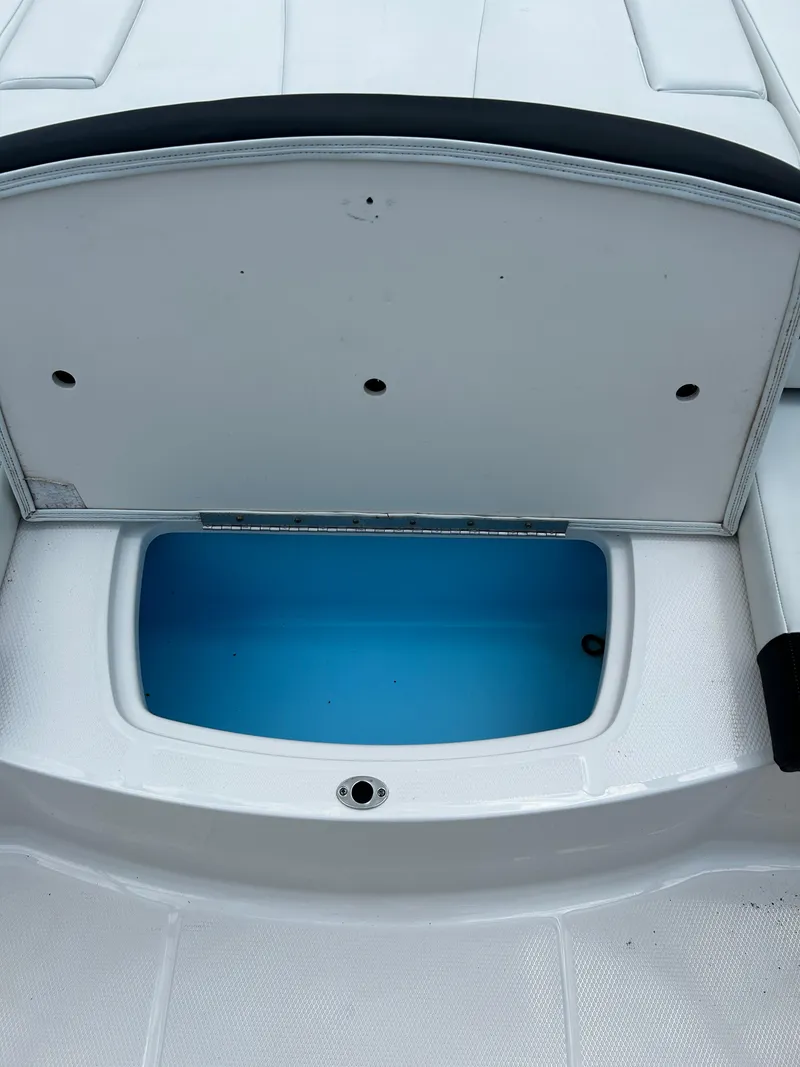 Slide: The Image of Open storage compartment on 2018 Chaparral 21 H2O Sport OB boat. - 33
