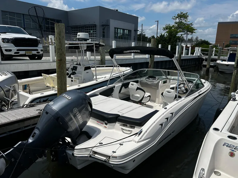 Slide: The Image of 2018 Chaparral 21 H2O Sport OB boat docked with Yamaha outboard motor. - 4