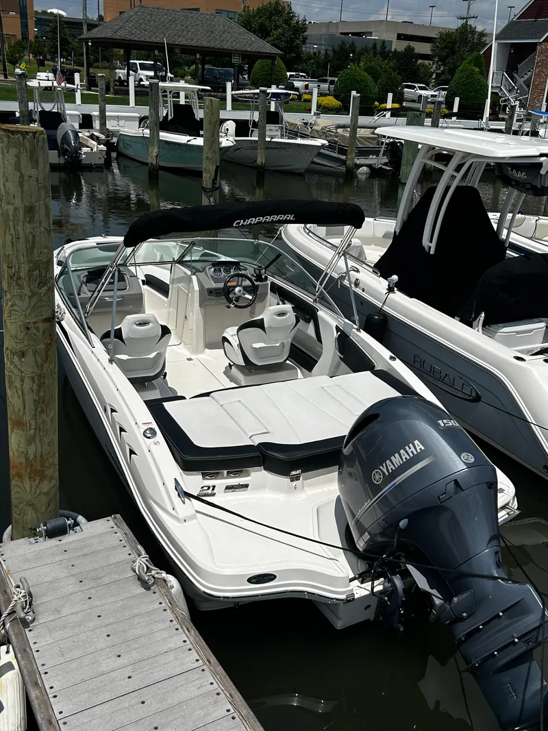 Slide: The Image of 2018 Chaparral 21 H2O Sport OB boat docked with Yamaha outboard engine. - 6