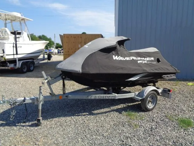 Slide: The Image of 2015 Yamaha WaveRunner FX Cruiser H/O on trailer, covered, parked outdoors. - 11
