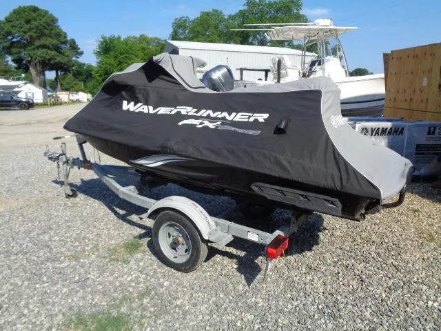 Slide: The Image of 2015 Yamaha WaveRunner FX Cruiser H/O on trailer, covered, parked outdoors. - 12