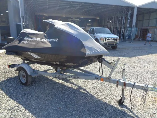 Slide: The Image of 2015 Yamaha WaveRunner FX Cruiser H/O on trailer, covered, parked outside a garage. - 14