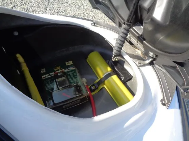 Slide: The Image of Open storage compartment of 2015 Yamaha WaveRunner FX Cruiser H/O with safety equipment. - 4
