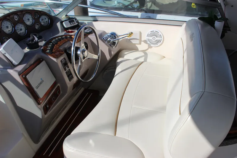 Slide: The Image of 2004 Rinker 342 Express Cruiser helm with steering wheel and navigation instruments. - 14