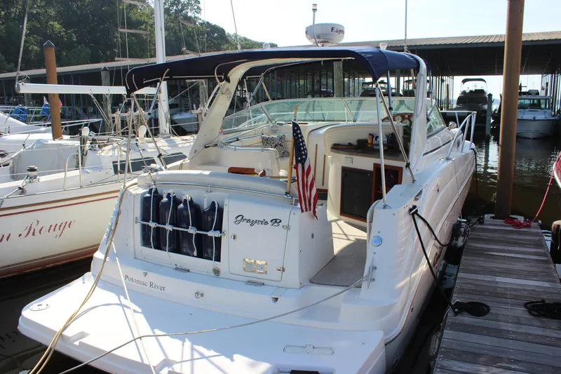 Slide: The Image of 2004 Rinker 342 Express Cruiser docked with American flag, Potomac River. - 1