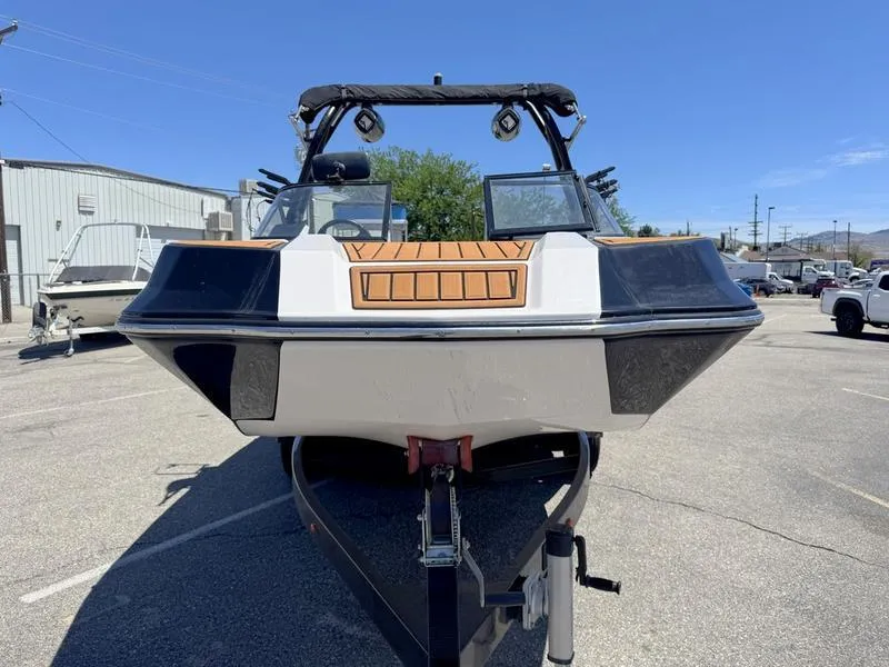 Slide: The Image of 2017 Moomba Helix boat on trailer in parking lot, front view. - 1