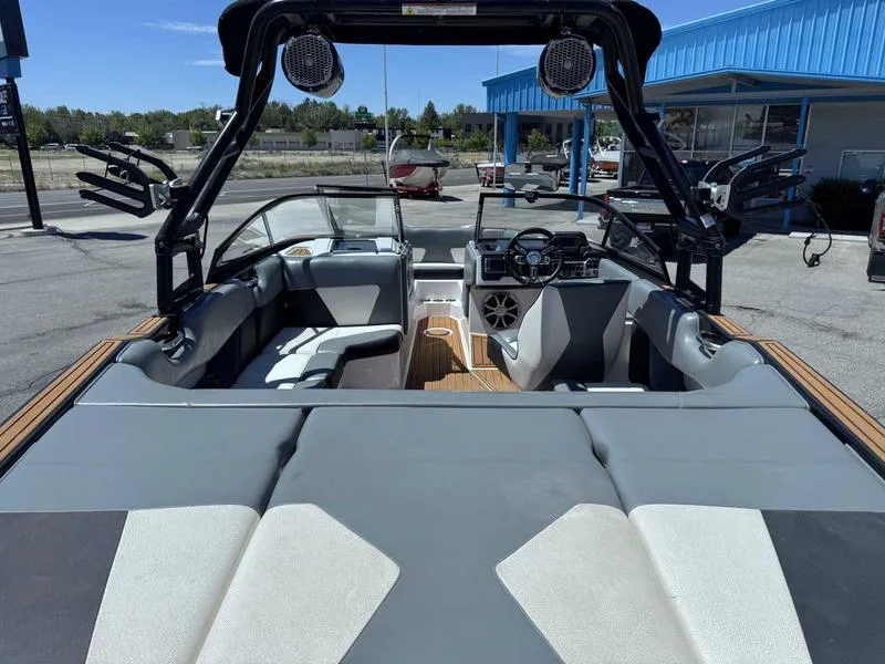 Slide: The Image of 2017 Moomba Helix boat interior with seating, steering wheel, and speakers. - 20