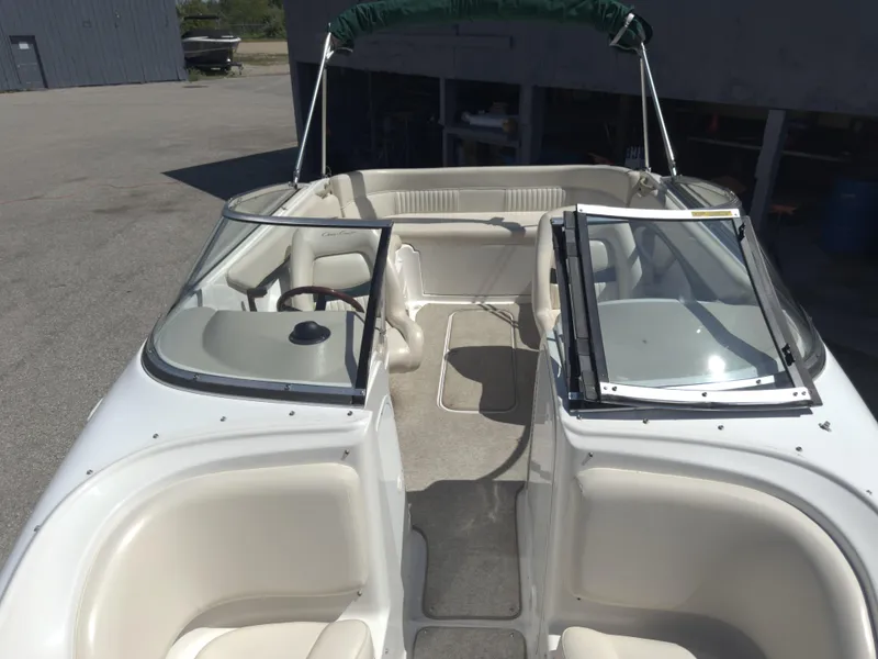 Slide: The Image of 1999 Chris-Craft 210 Bowrider boat interior with open seating and windshield. - 7