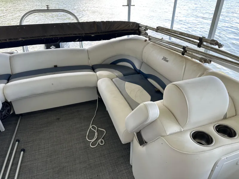 Slide: The Image of 2017 JC 25 Neptoon TT Sport boat interior with white seating and cup holders. - 15
