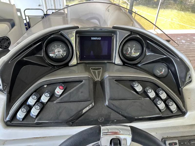 Slide: The Image of Dashboard of a 2017 JC 25 Neptoon TT Sport boat with gauges and controls. - 19