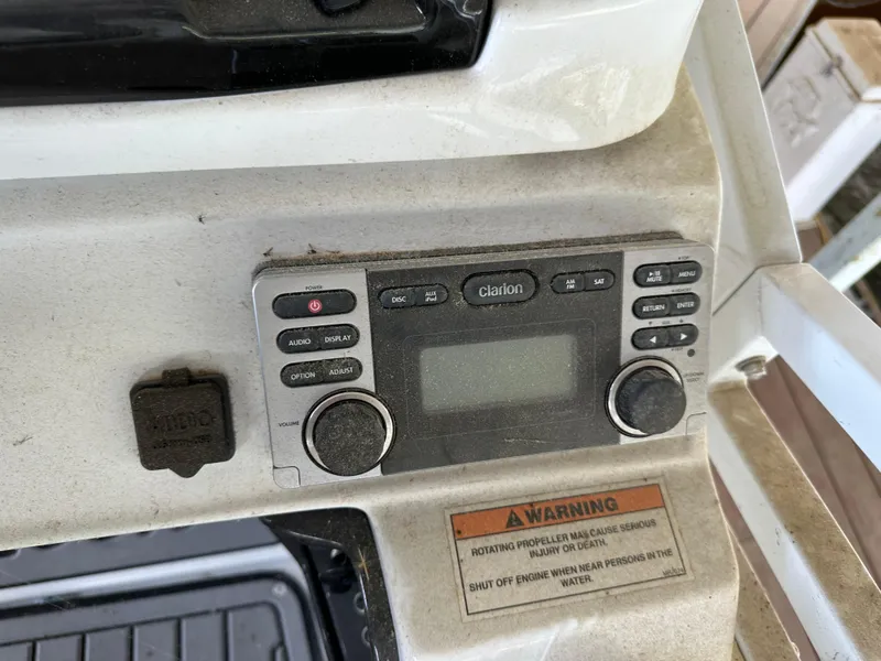 Slide: The Image of Control panel of a 2017 JC 25 Neptoon TT Sport boat with Clarion audio system. - 22