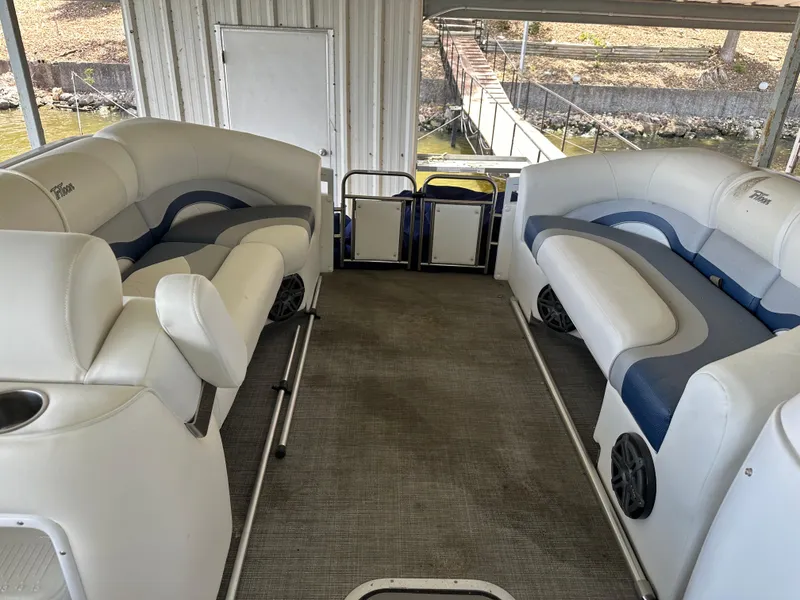 Slide: The Image of 2017 JC 25 Neptoon TT Sport pontoon boat interior with plush seating and lake view. - 25