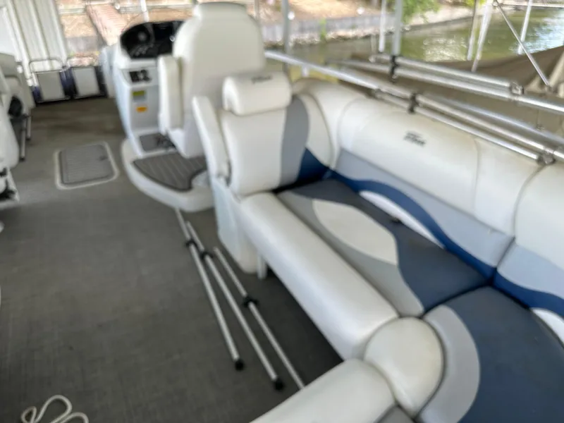 Slide: The Image of 2017 JC 25 Neptoon TT Sport boat interior with white and blue seating. - 27