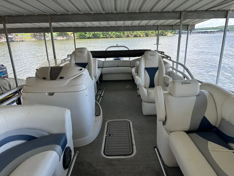 Slide: The Image of 2017 JC 25 Neptoon TT Sport pontoon boat interior with white seating under a canopy. - 3