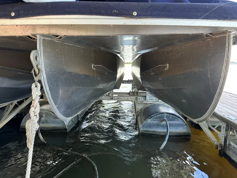 Slide: The Image of Underneath view of a 2017 JC 25 Neptoon TT Sport pontoon boat docked. - 8