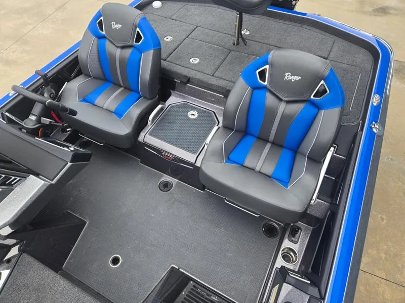 Slide: The Image of 2024 Ranger Z521R boat interior with blue and gray seats, featuring modern design and functionality. - 7