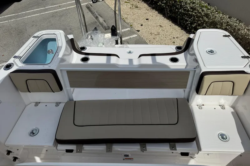 Slide: The Image of 2025 Yamaha Boats 252 FSH Sport interior with seating and storage compartments. - 23