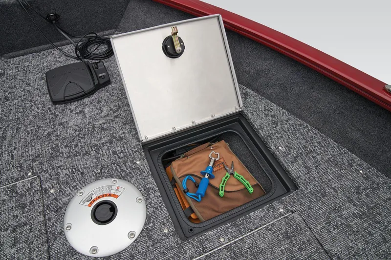 Slide: The Image of 2026 Tracker Pro Guide V-16 WT boat storage compartment with tools and accessories. - 20