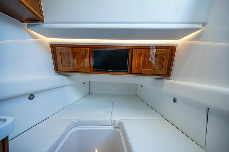 Slide: The Image of Luxurious interior cabin of 2022 HCB 53 boat with wood accents and modern lighting. - 10