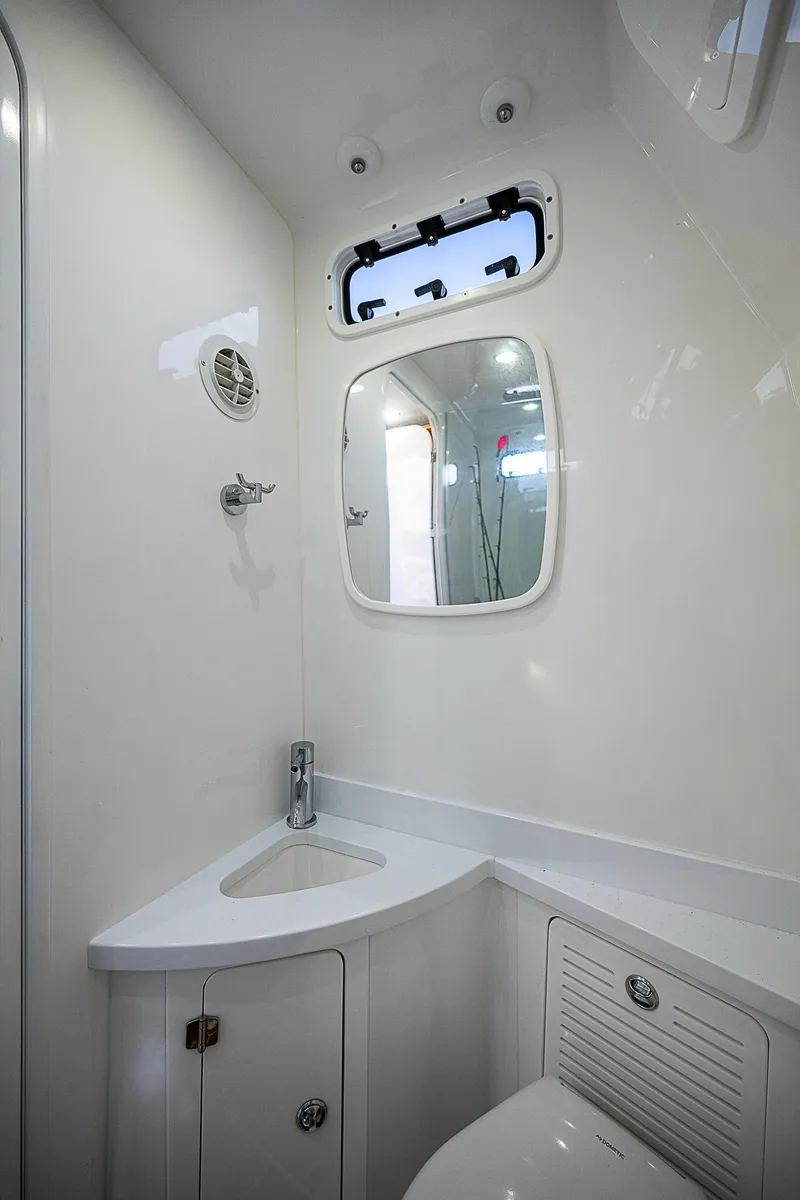 Slide: The Image of 2022 HCB 53 yacht bathroom with modern fixtures and compact design. - 14