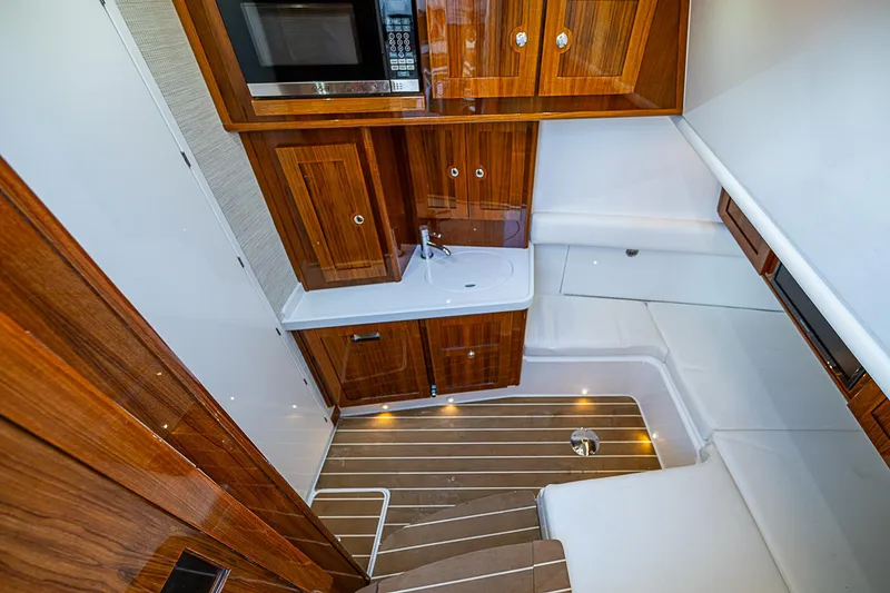 Slide: The Image of Luxurious interior of 2022 HCB 53 yacht with wood cabinetry and modern amenities. - 9