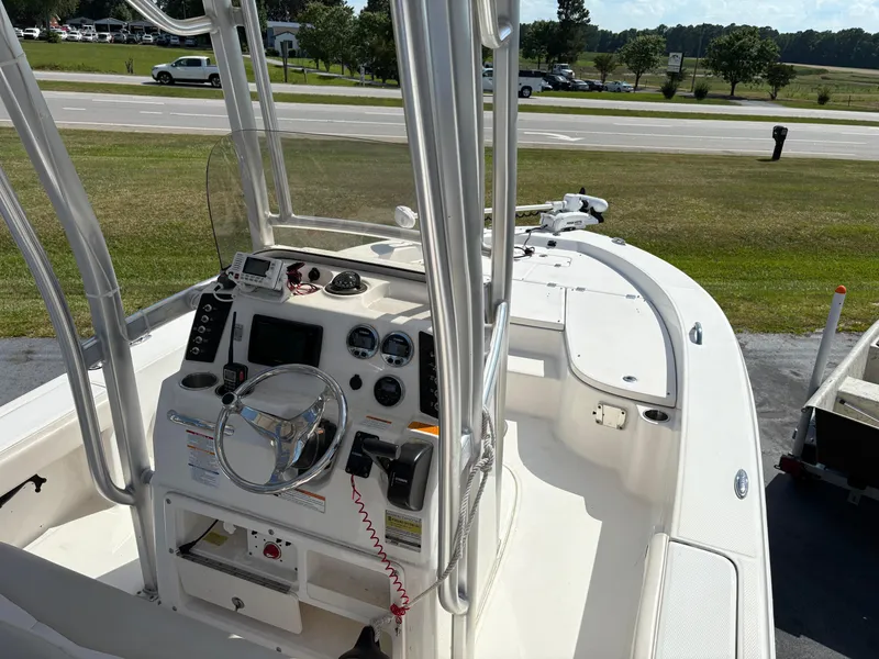Slide: The Image of 2017 Robalo 226 Cayman boat interior with steering console and navigation equipment. - 10