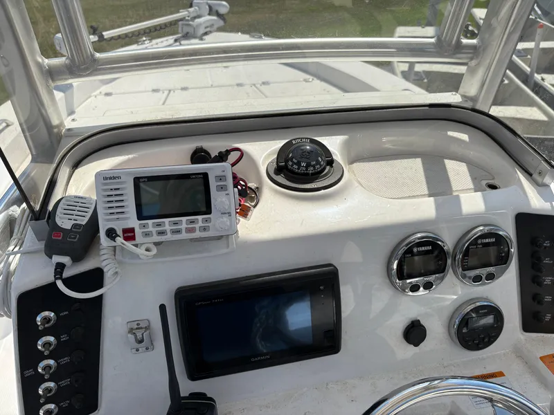 Slide: The Image of Control panel of a 2017 Robalo 226 Cayman boat with navigation and communication equipment. - 12