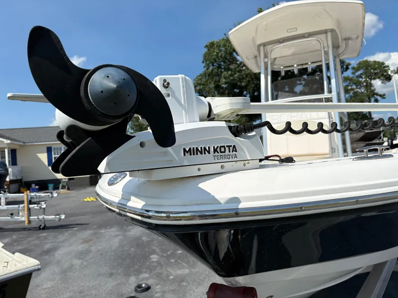 Slide: The Image of 2017 Robalo 226 Cayman boat with Minn Kota Terrova trolling motor, parked outdoors. - 3