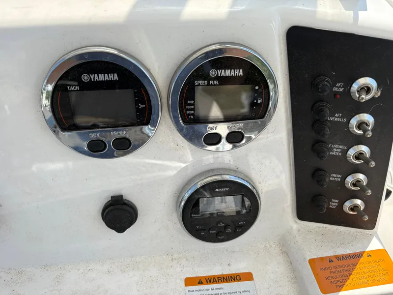 Slide: The Image of Control panel of a 2017 Robalo 226 Cayman boat with Yamaha gauges and switches. - 8