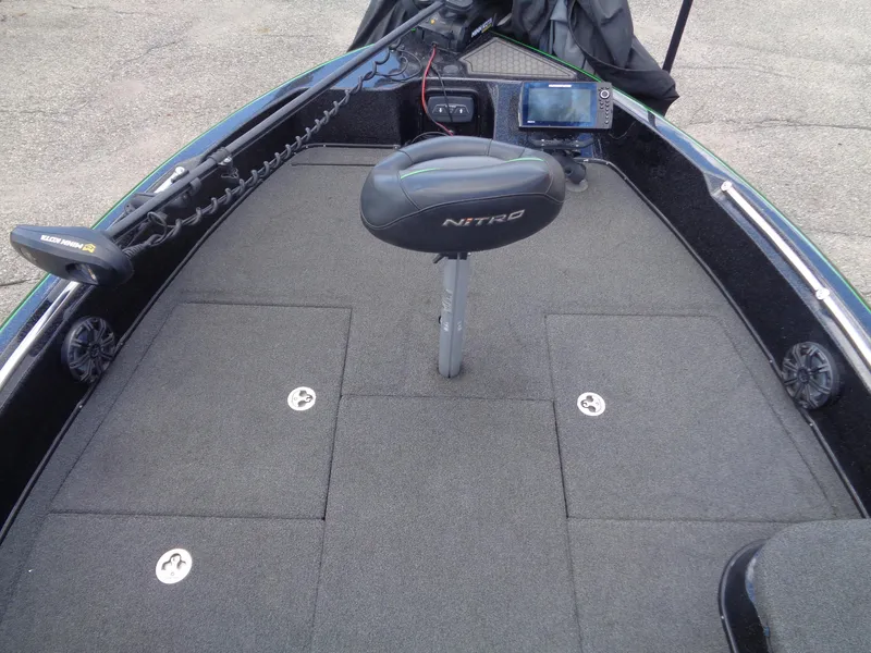 Slide: The Image of 2022 Nitro ZV21 boat deck with seat, storage compartments, and electronic equipment. - 10