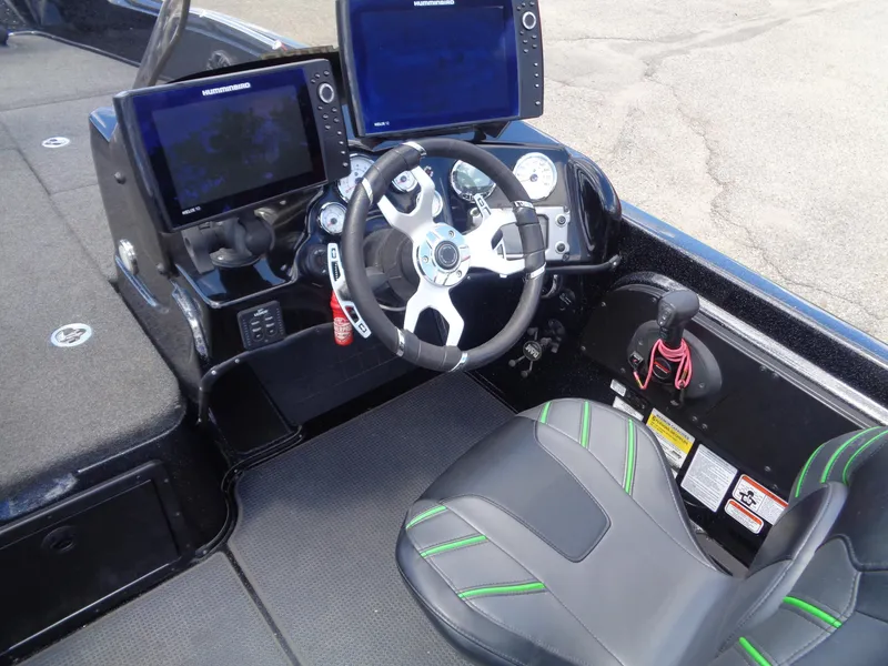 Slide: The Image of 2022 Nitro ZV21 boat cockpit with dual Humminbird displays and modern steering wheel. - 14