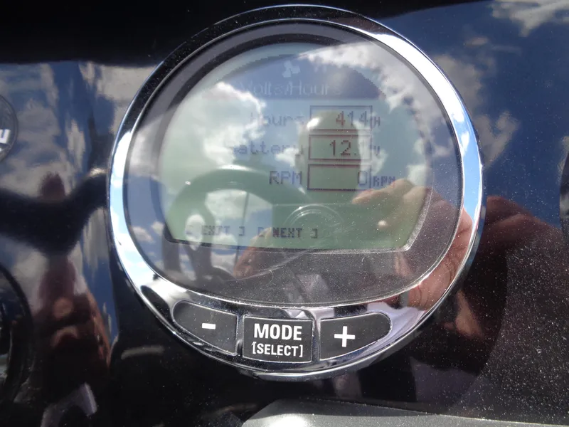 Slide: The Image of Close-up of Nitro ZV21 2022 dashboard display showing hours, battery, and RPM. - 16