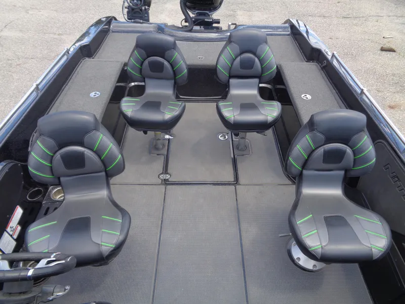 Slide: The Image of 2022 Nitro ZV21 boat interior with four black and green seats. - 7