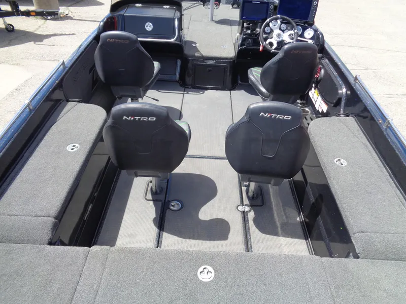 Slide: The Image of Interior of a 2022 Nitro ZV21 boat with four seats and steering console. - 8