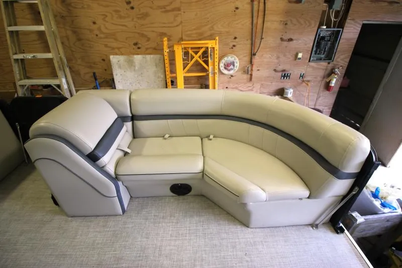 Slide: The Image of 2017 South Bay 222 CR boat seating in a workshop setting. - 10