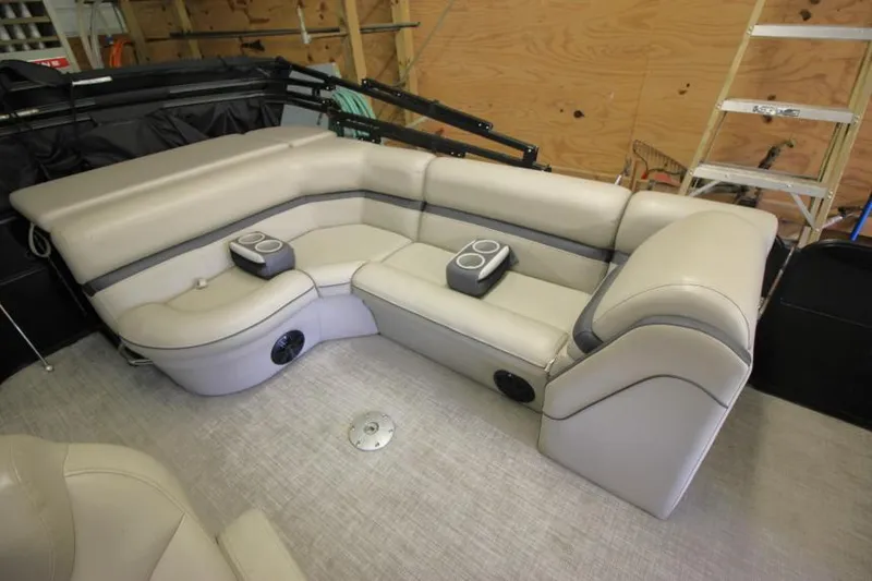 Slide: The Image of 2017 South Bay 222 CR boat interior with beige seating and cup holders. - 3