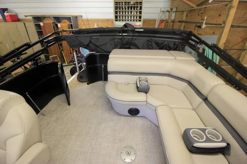 Slide: The Image of 2017 South Bay 222 CR pontoon boat interior with beige seating and cup holders. - 4