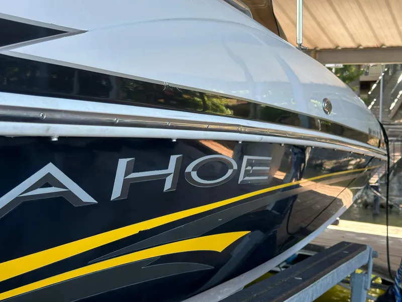 Slide: The Image of 2005 Tahoe 195 OB boat with sleek design and bold graphics. - 38