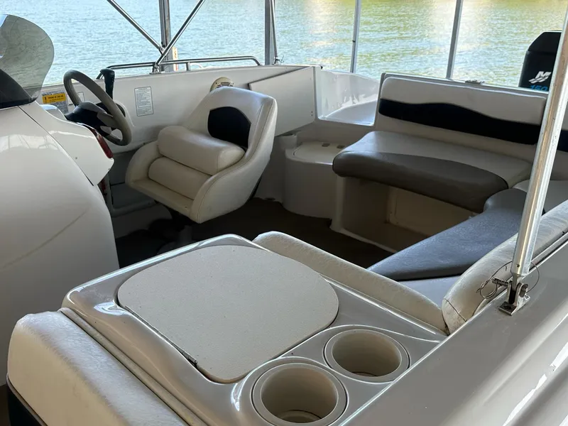 Slide: The Image of Interior of a 2005 Tahoe 195 OB boat with seating and cup holders. - 45