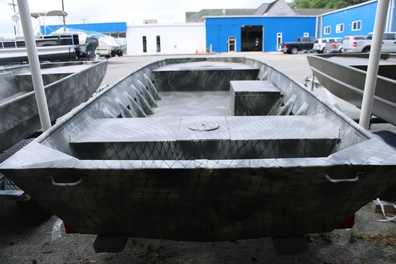 Slide: The Image of 2025 WeldBilt 1648V aluminum boat in a showroom, showcasing its durable design. - 4