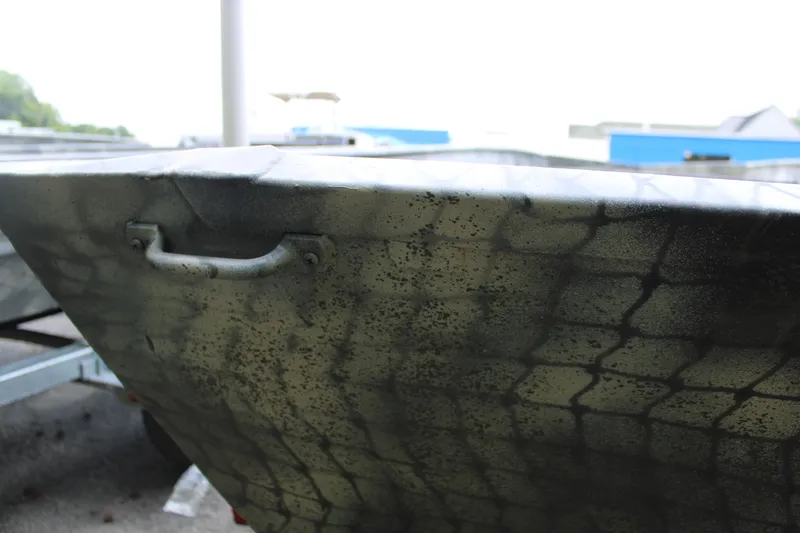 Slide: The Image of 2025 WeldBilt 1648V boat with camouflage pattern and sturdy handle. - 5