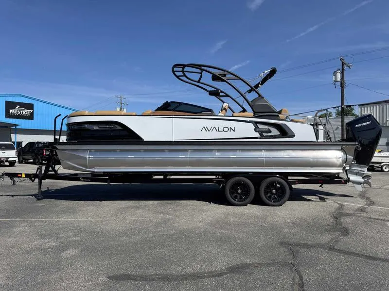 Slide: The Image of 2025 Avalon 2585 27-3 Excalibur LTD QL pontoon boat on trailer, outdoor display. - 14